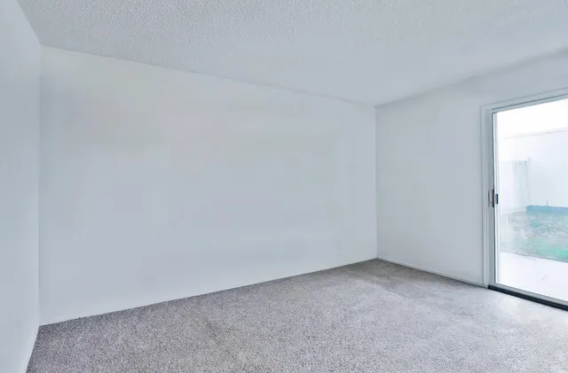 a view of an empty room and window