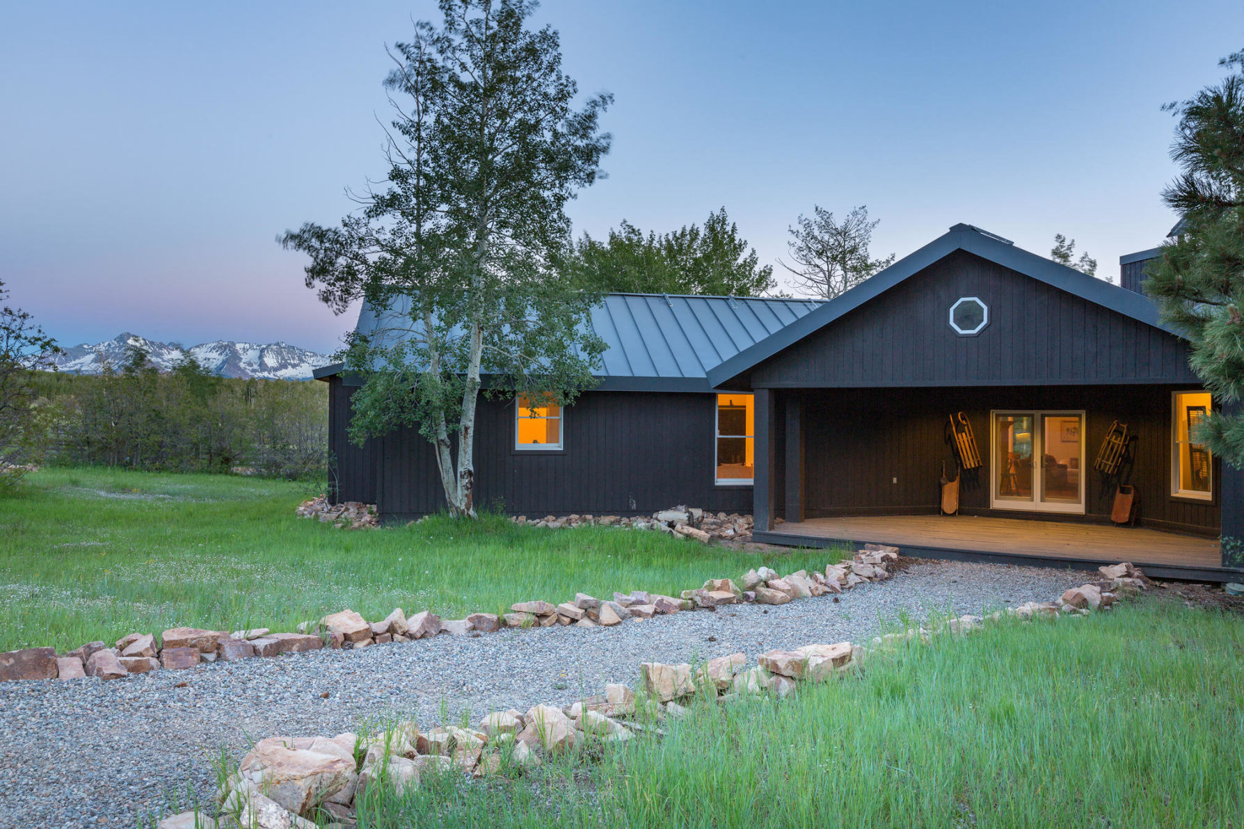 3289 Laughing Dog Road Placerville, CO 81430 - Photo 12 of 52 a front view of a house with a yard and garage