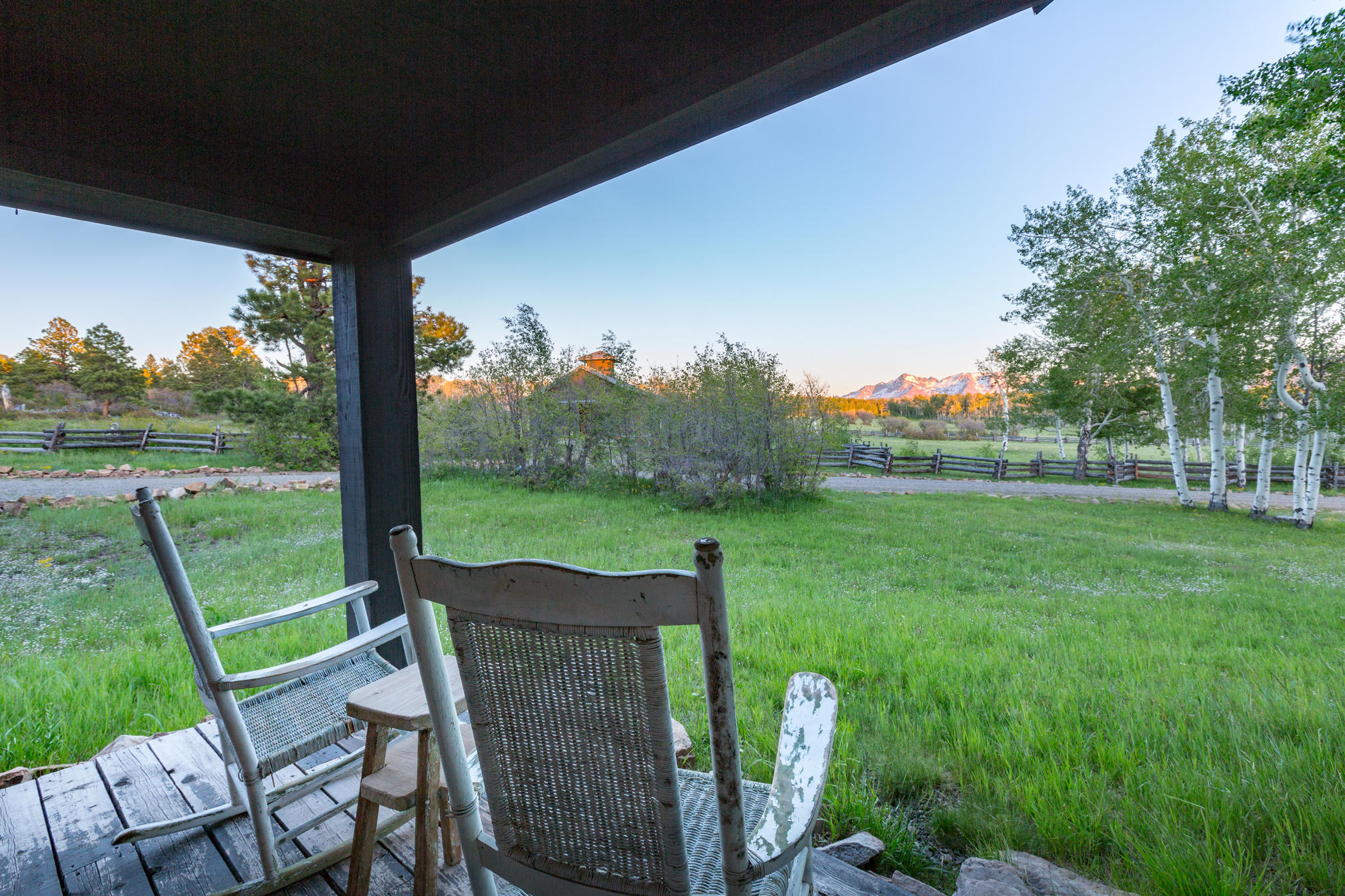 3289 Laughing Dog Road Placerville, CO 81430 - Photo 17 of 52 a view of a porch with furniture and garden