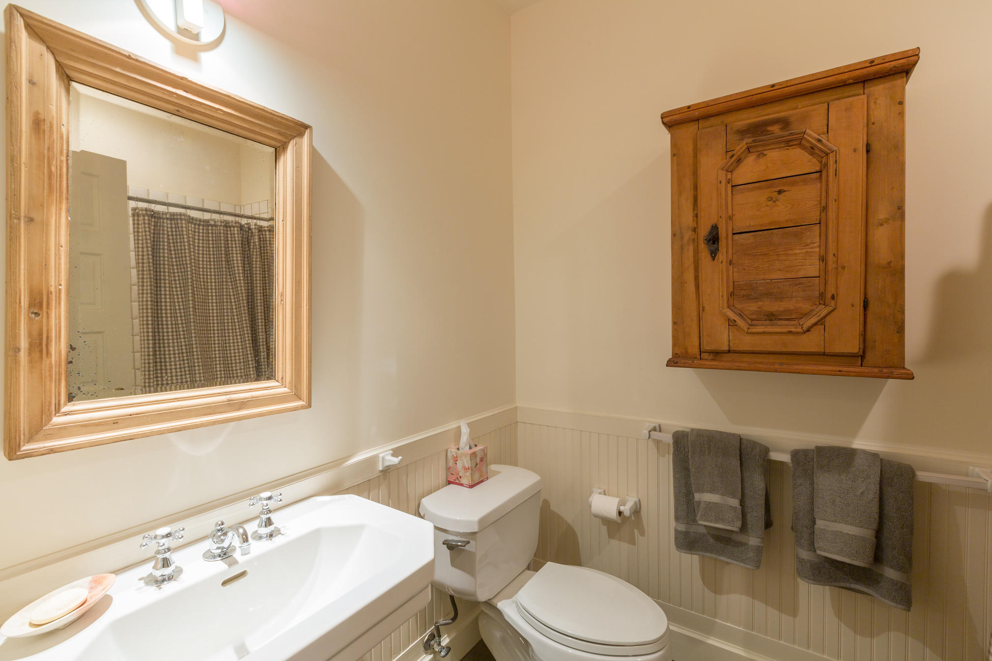 3289 Laughing Dog Road Placerville, CO 81430 - Photo 22 of 52 a bathroom with a toilet sink and mirror