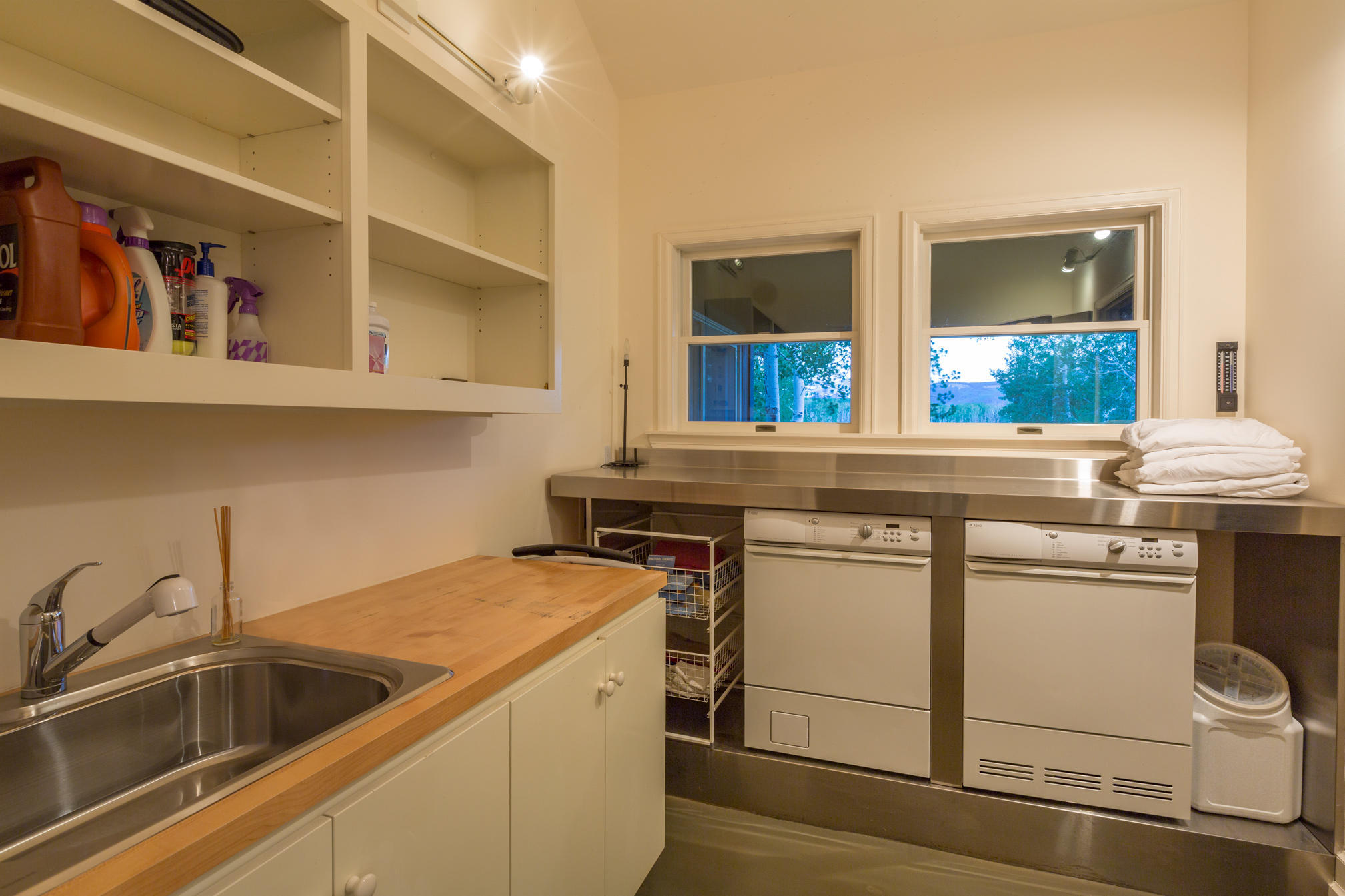 3289 Laughing Dog Road Placerville, CO 81430 - Photo 23 of 52 a view of a sink and dishwasher with wooden floor