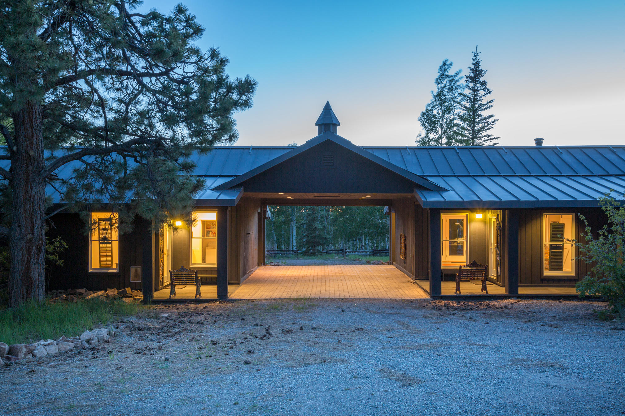 3289 Laughing Dog Road Placerville, CO 81430 - Photo 26 of 52 a front view of a house with a yard and garage