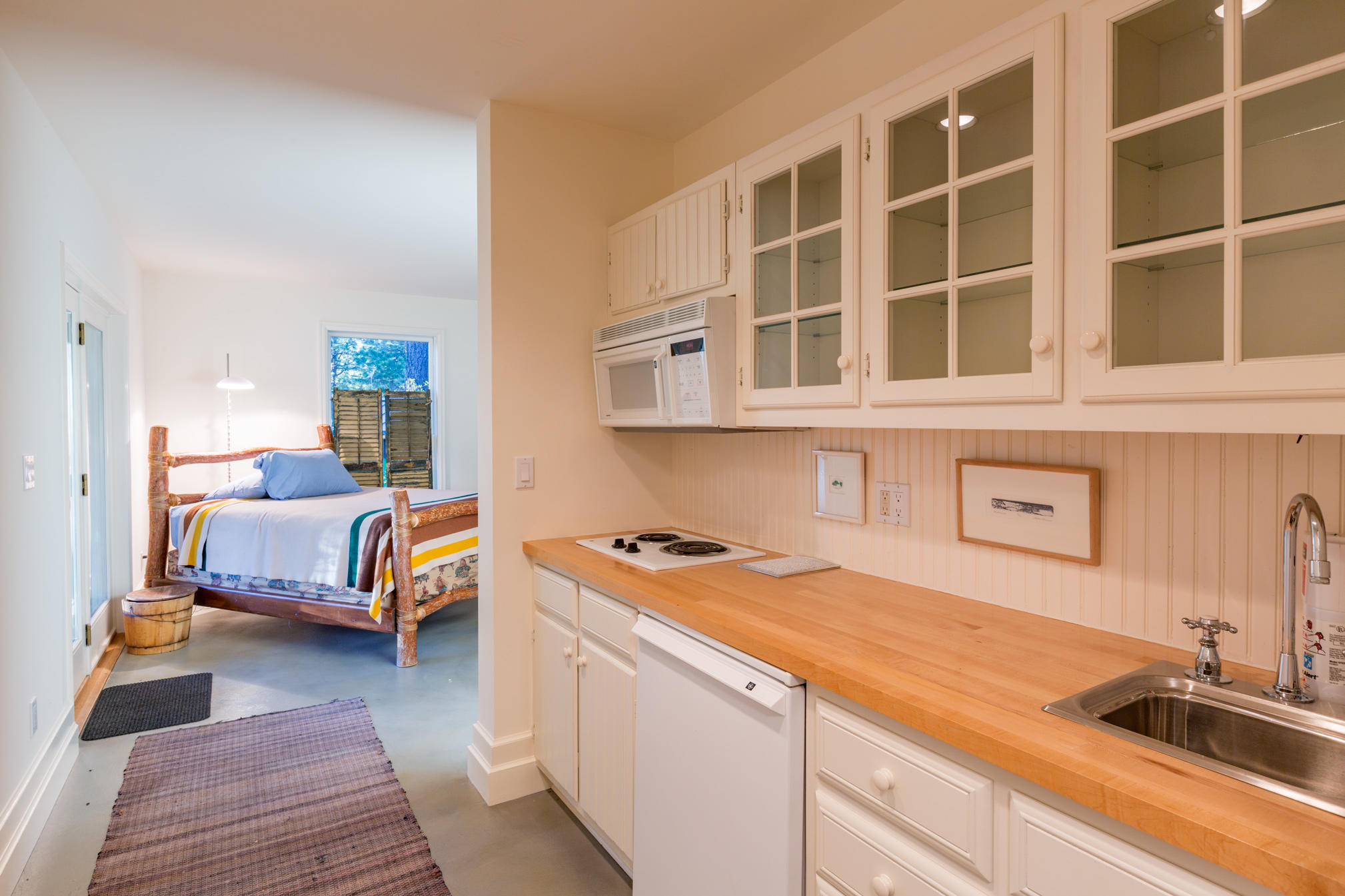 3289 Laughing Dog Road Placerville, CO 81430 - Photo 28 of 52 a bedroom with a bed and a view of living room