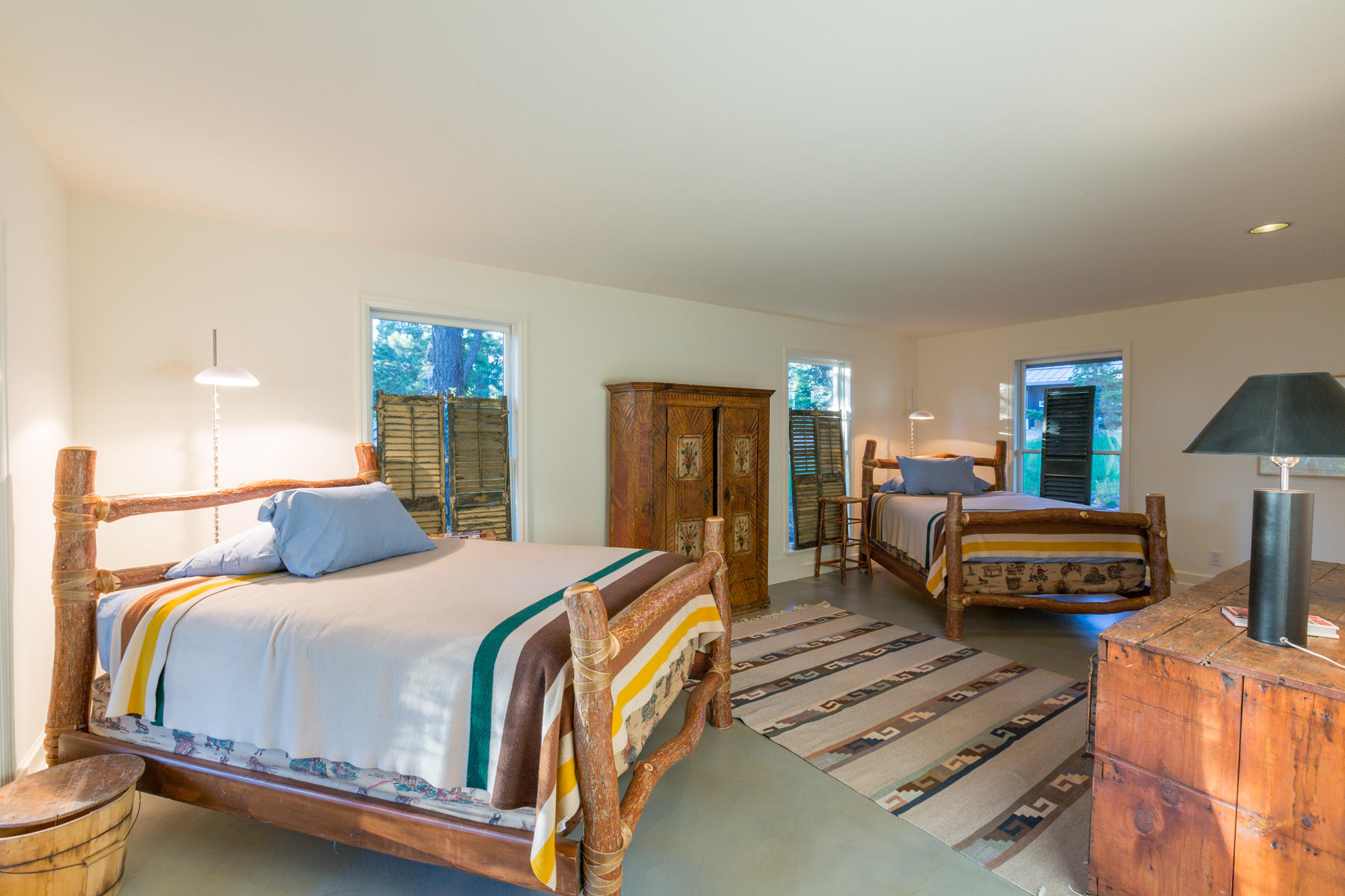 3289 Laughing Dog Road Placerville, CO 81430 - Photo 29 of 52 a bedroom with a bed and wooden floor