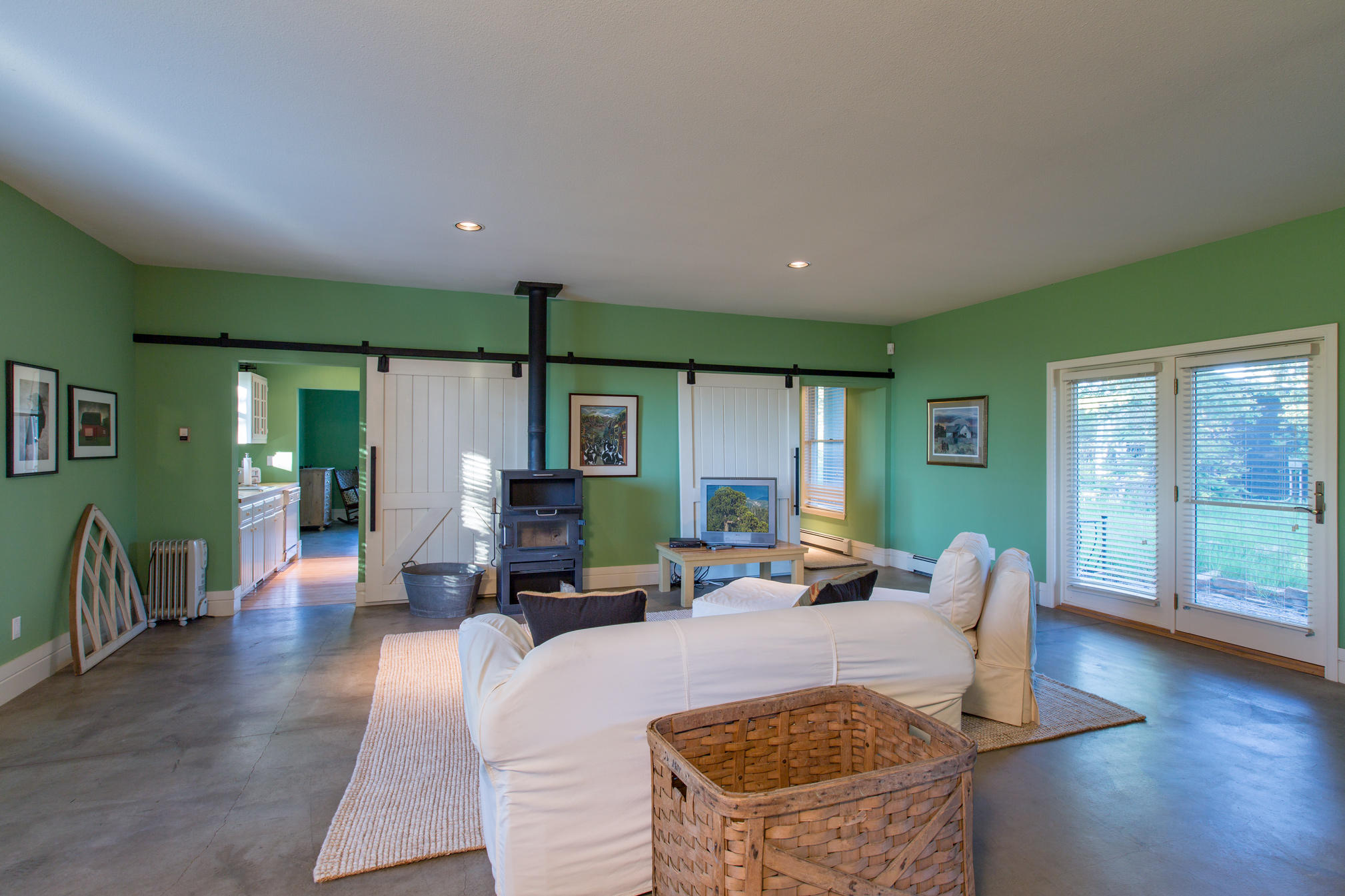 3289 Laughing Dog Road Placerville, CO 81430 - Photo 36 of 52 a living room with furniture a large window with wooden floor
