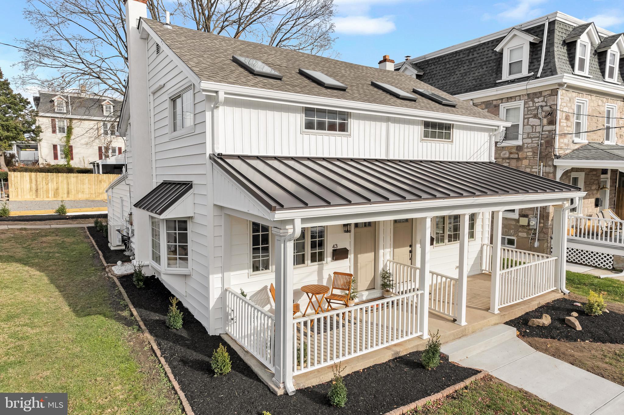 43 North Spring Garden Street Ambler, PA 19002 - Photo 1 of 1 a porch with a table and chairs