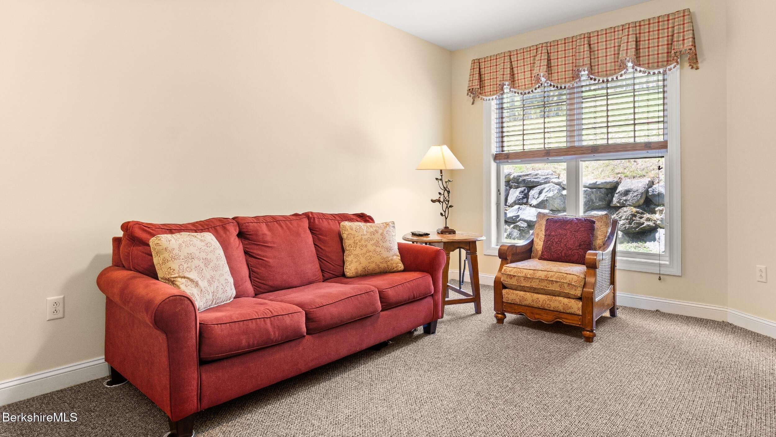 14 Alpine Trail, Unit 14 Pittsfield, MA 01201 - Photo 14 of 29 a living room with furniture and a large window