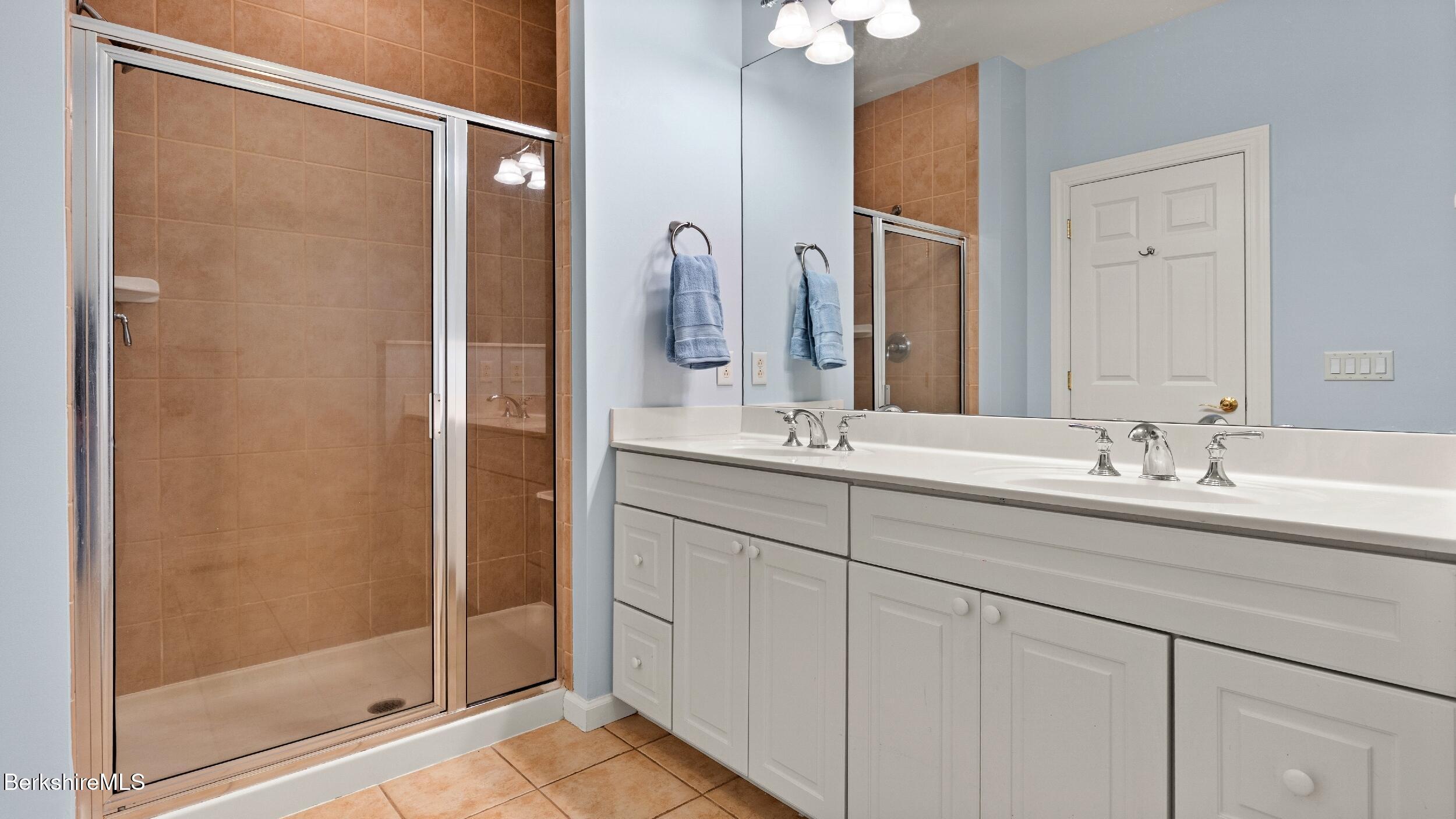 14 Alpine Trail, Unit 14 Pittsfield, MA 01201 - Photo 15 of 29 a bathroom with a double vanity sink and a mirror