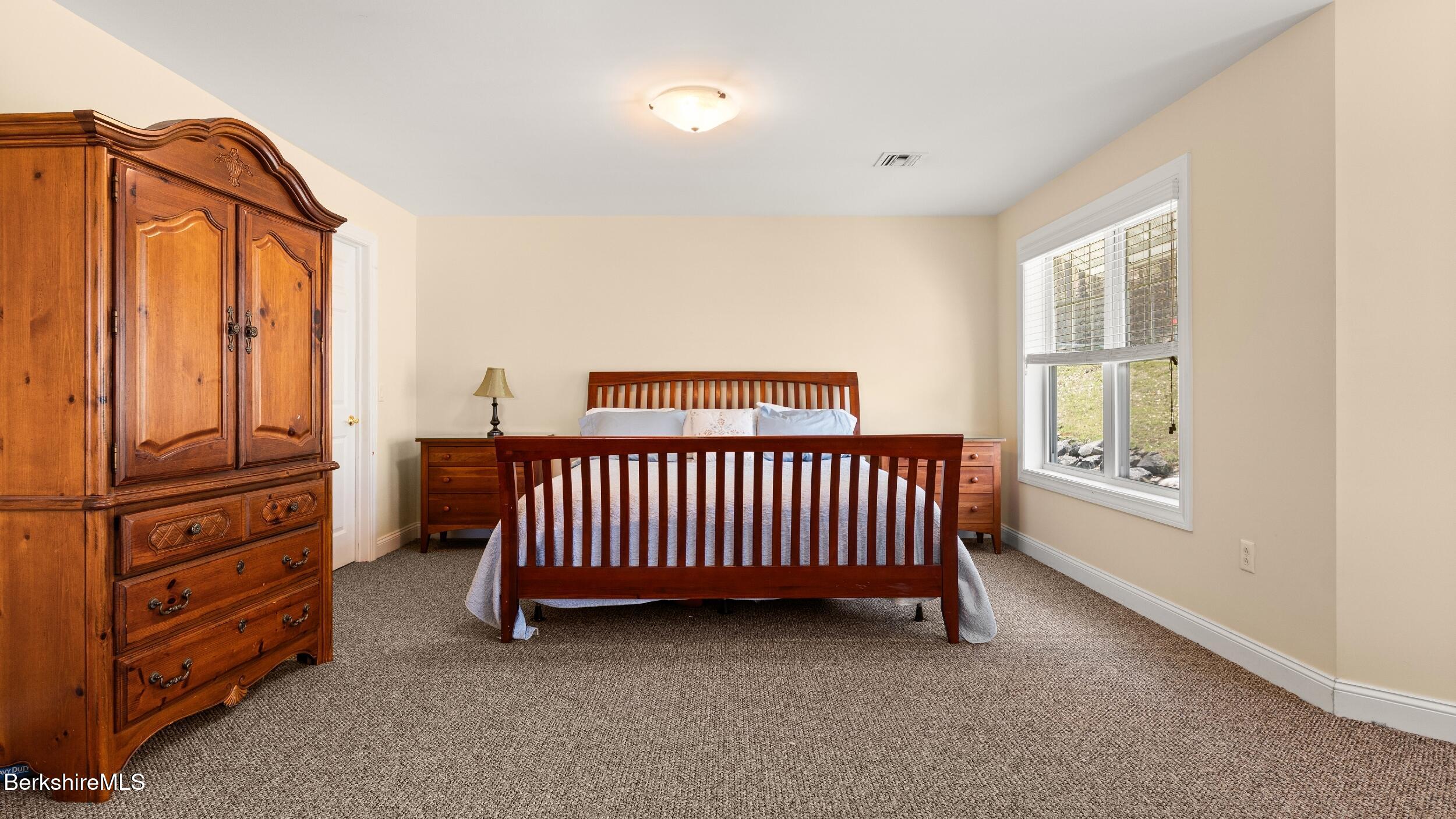 14 Alpine Trail, Unit 14 Pittsfield, MA 01201 - Photo 21 of 29 a view of a bedroom with furniture and staircase