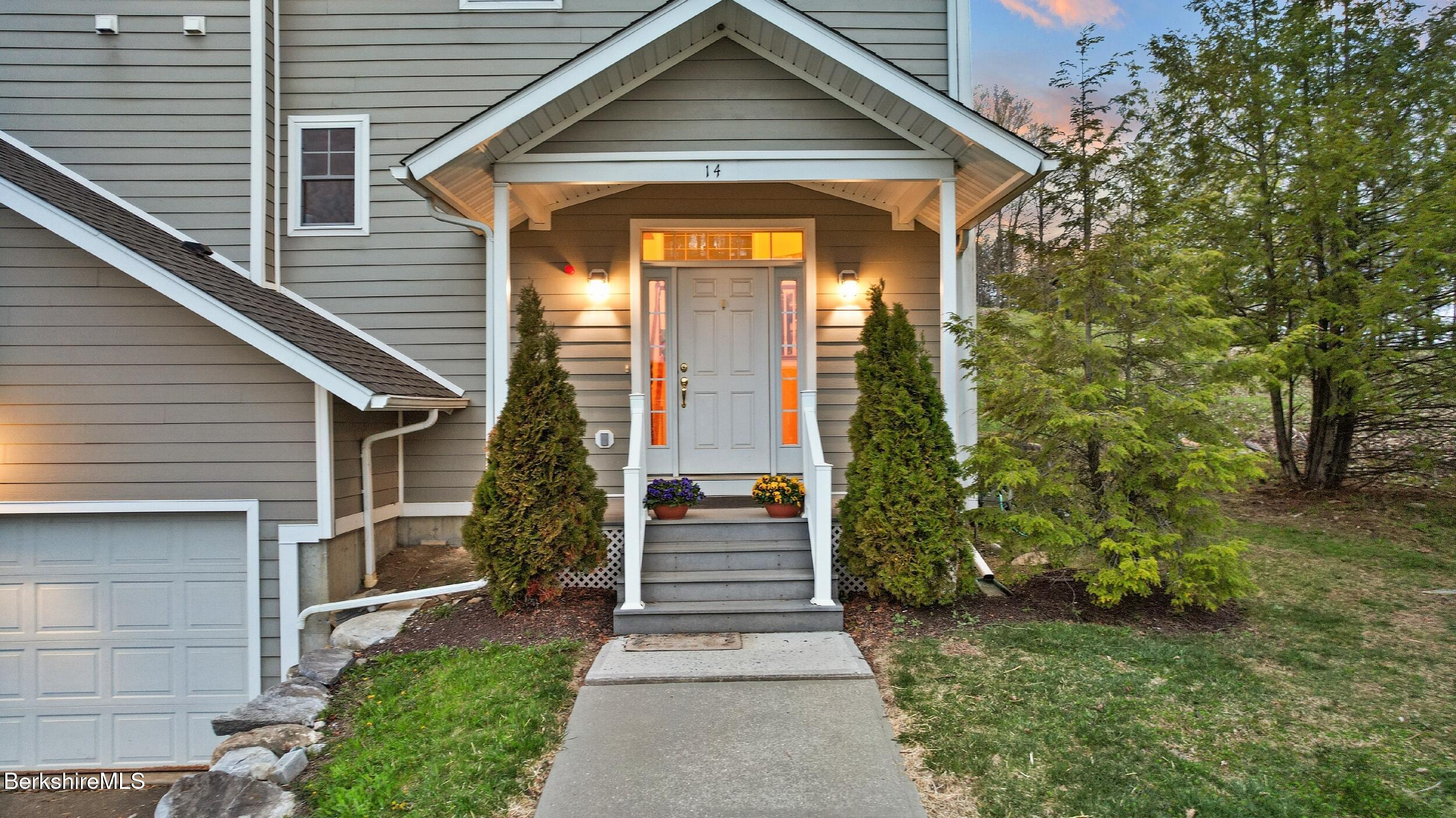 14 Alpine Trail, Unit 14 Pittsfield, MA 01201 - Photo 5 of 29 a front view of a house with a garden