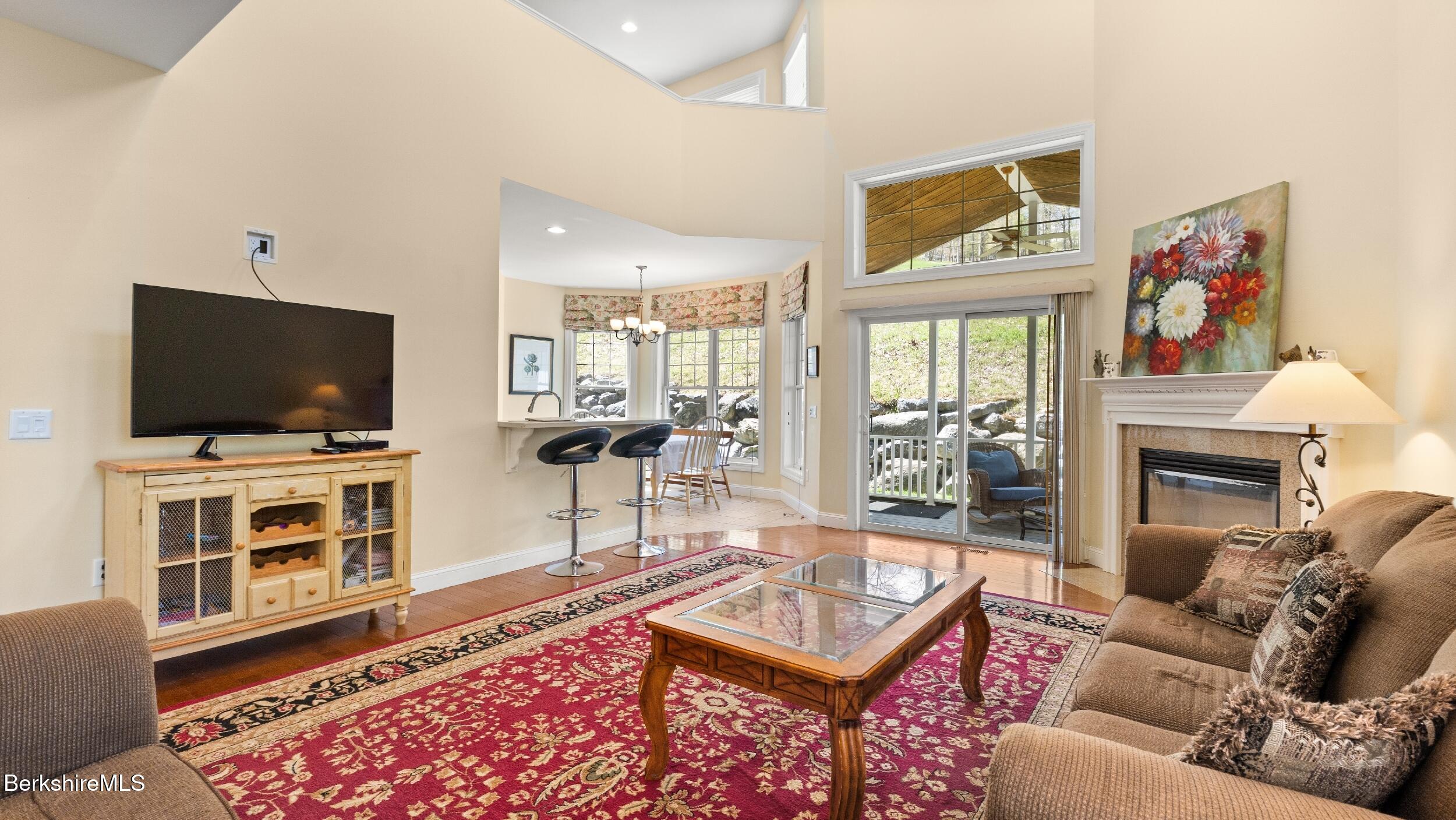 14 Alpine Trail, Unit 14 Pittsfield, MA 01201 - Photo 6 of 29 a living room with furniture and a flat screen tv