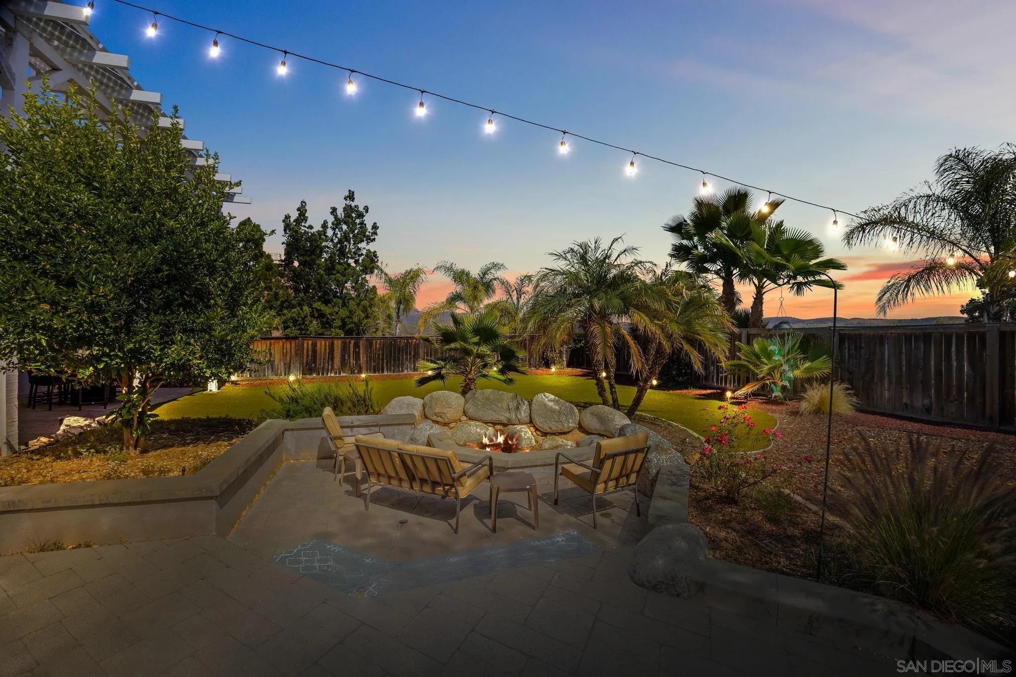 13628 Sunset View Road Poway, CA 92064 - Photo 46 of 70 a view of a patio with table and chairs and potted plants