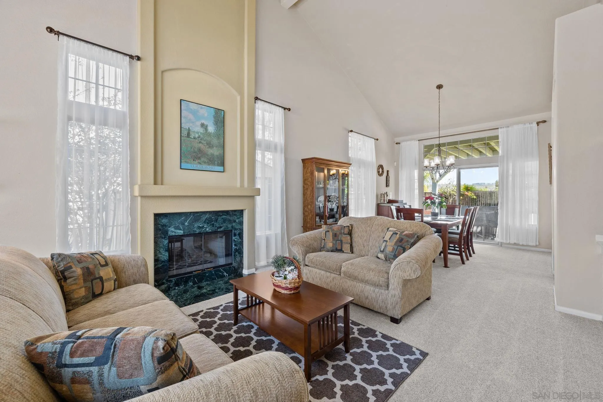 13628 Sunset View Road Poway, CA 92064 - Photo 5 of 70 a living room with furniture and a fireplace