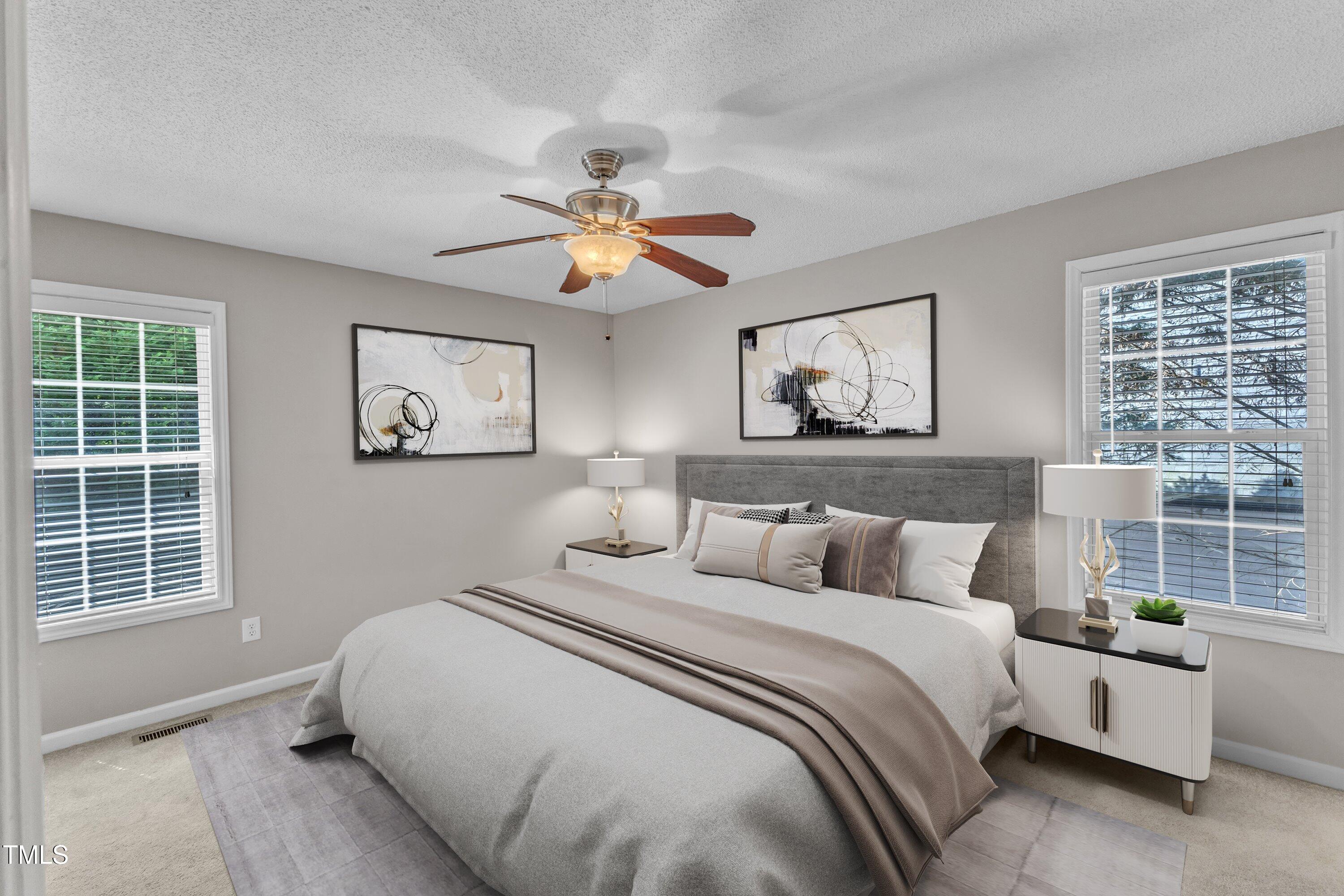 4533 Whistling Way Raleigh, NC 27616 - Photo 17 of 25 a bedroom with a large bed and a window