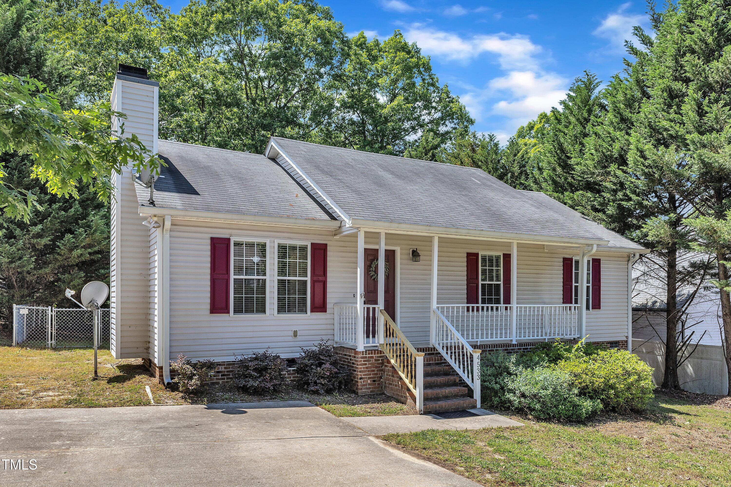 4533 Whistling Way Raleigh, NC 27616 - Photo 2 of 25 a front view of a house with garden