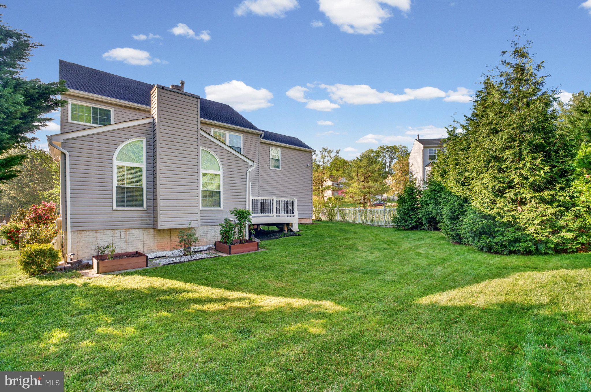 3226 Peverly Run Road Abingdon, MD 21009 - Photo 2 of 34 Spacious backyard with lush greenery.