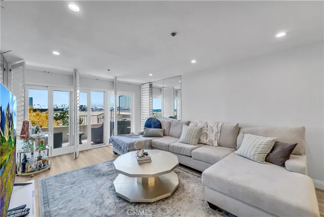 a kitchen with stainless steel appliances granite countertop a refrigerator sink and white cabinets