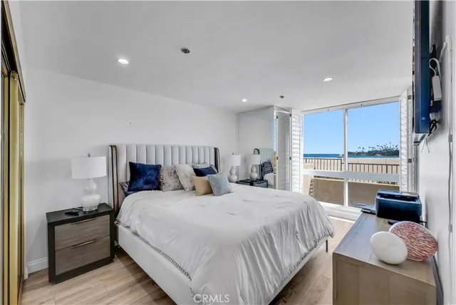 a bedroom with a bed and a lamp