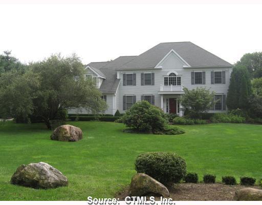 93 Newton Road Woodbridge, CT 06525 - Photo 1 of 1 a front view of a house with a yard