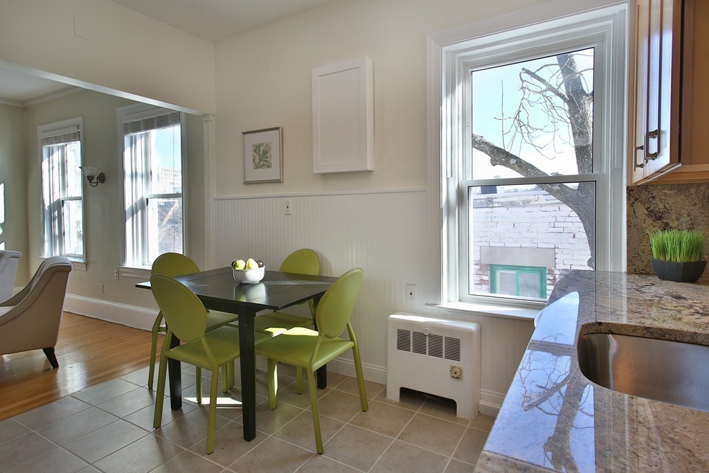 21 Warwick Road, Unit 6 Brookline, MA 02445 - Photo 3 of 10 a dining room with furniture and window