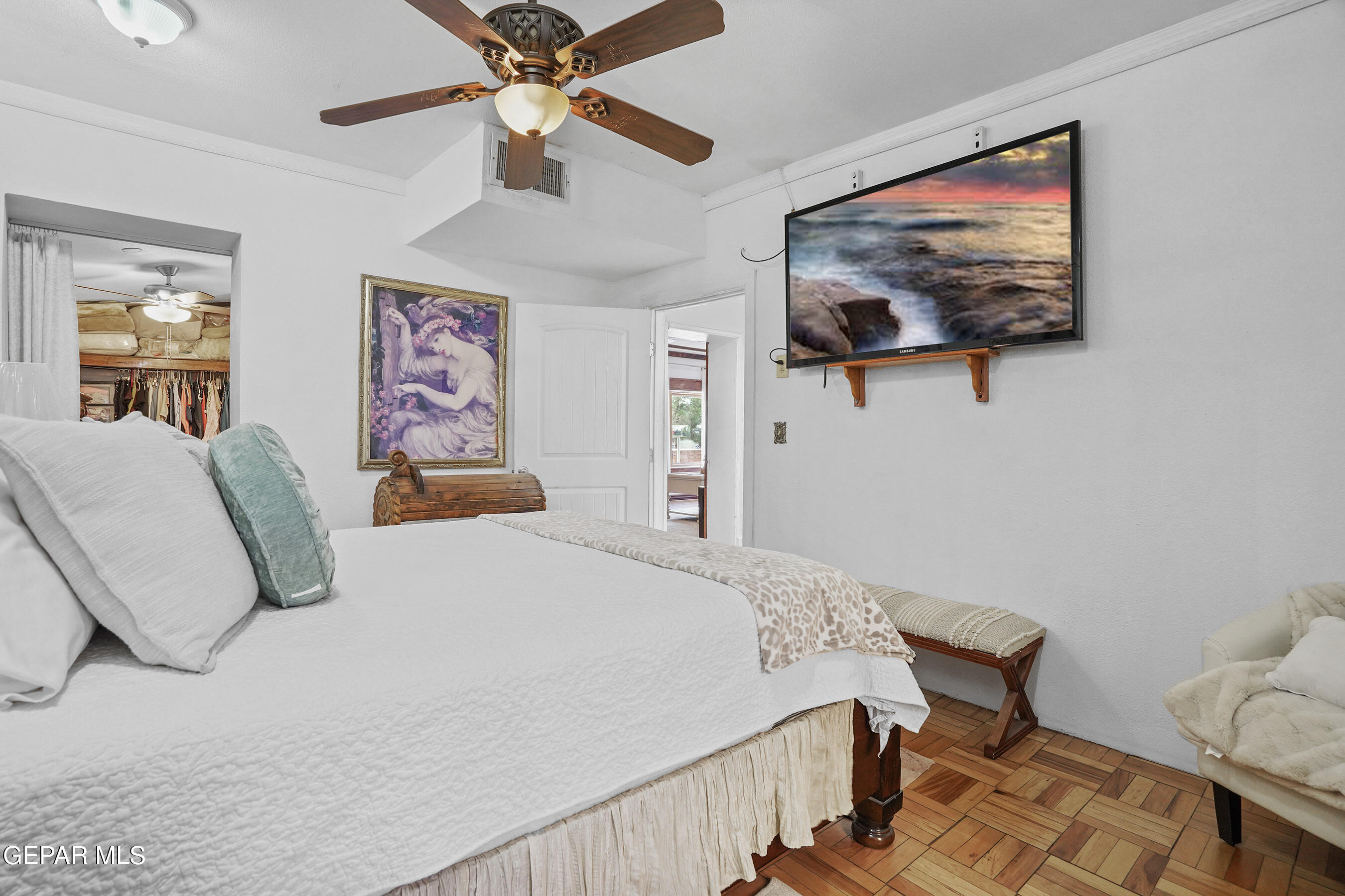 146 Croom Road El Paso, TX 79915 - Photo 15 of 54 a bedroom with a bed and a painting on the wall