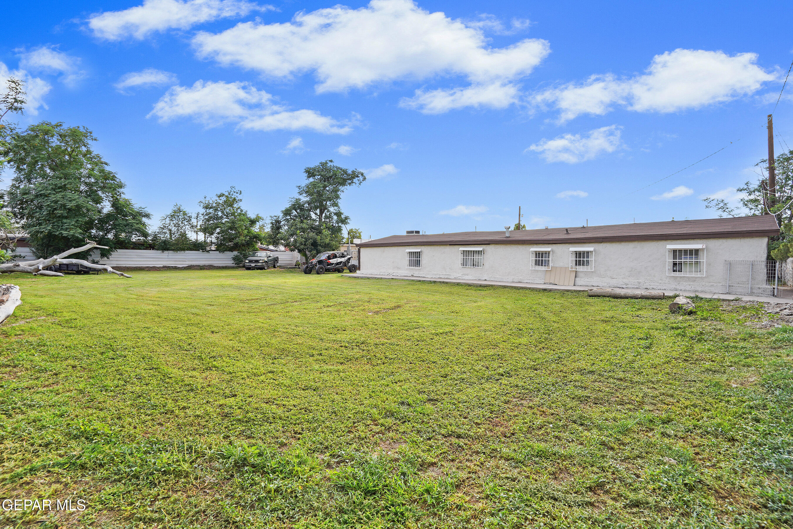 146 Croom Road El Paso, TX 79915 - Photo 17 of 54 a front view of a house with a big yard