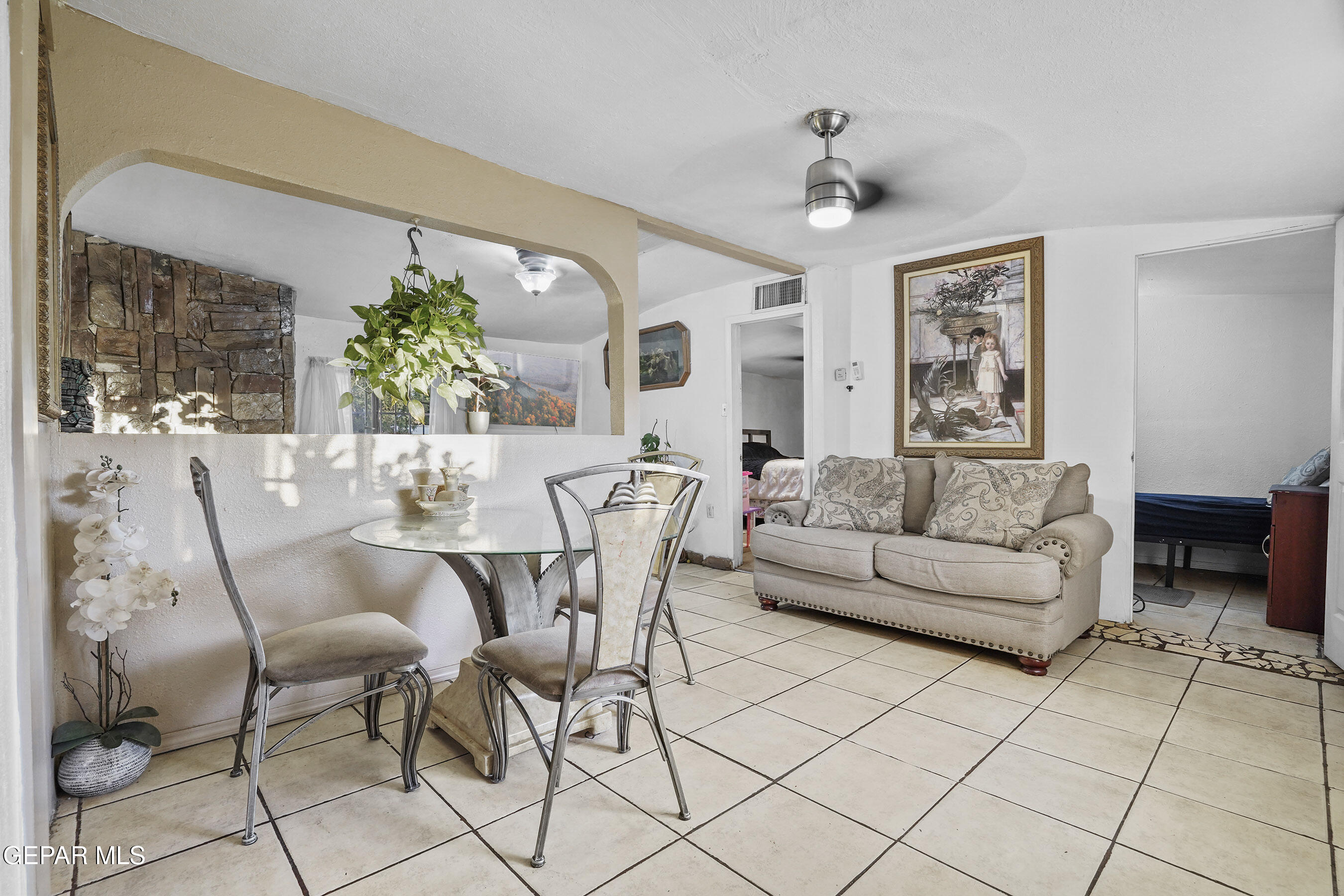 146 Croom Road El Paso, TX 79915 - Photo 34 of 54 a living room with furniture and a chandelier