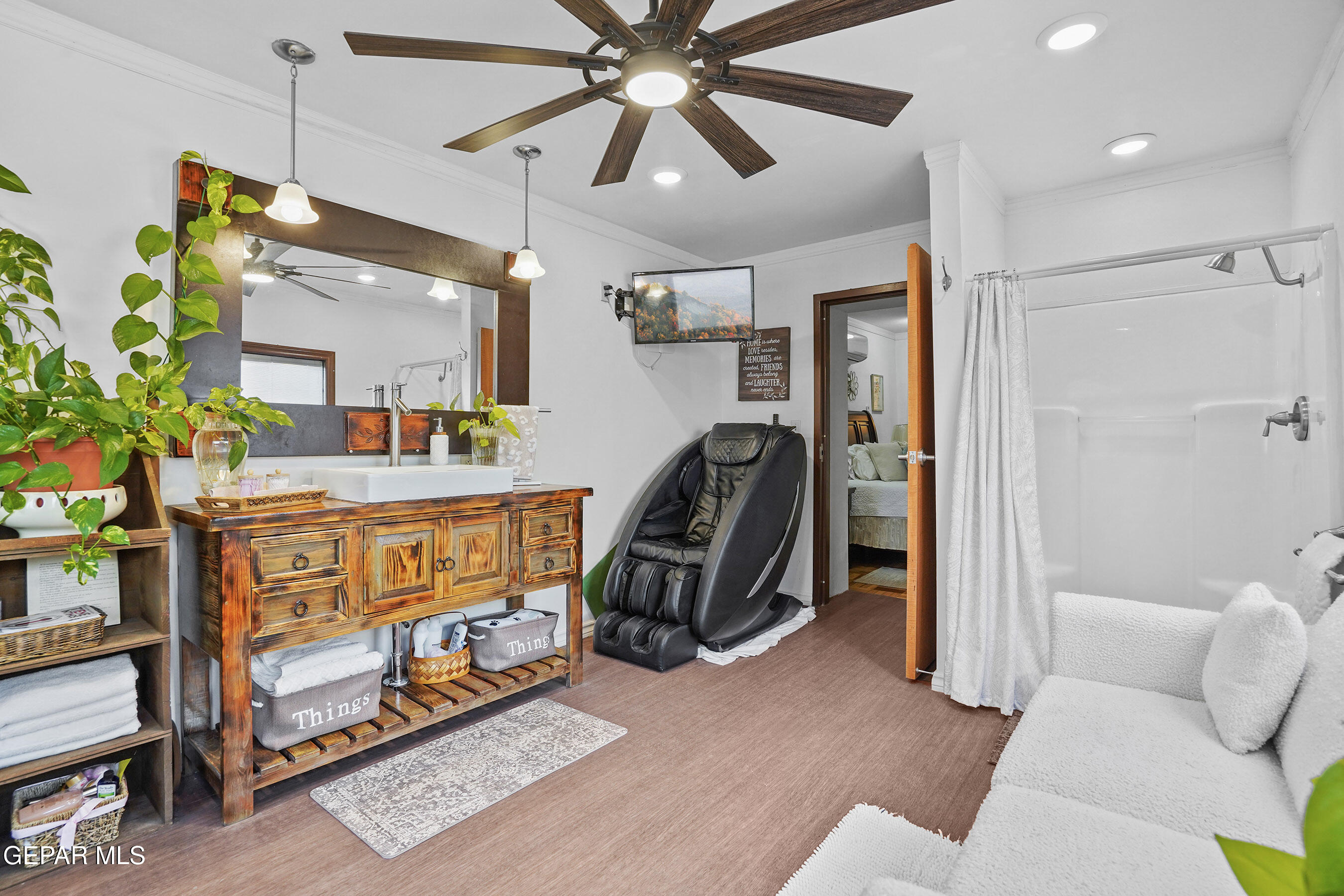 146 Croom Road El Paso, TX 79915 - Photo 37 of 54 a bedroom with furniture and a chandelier