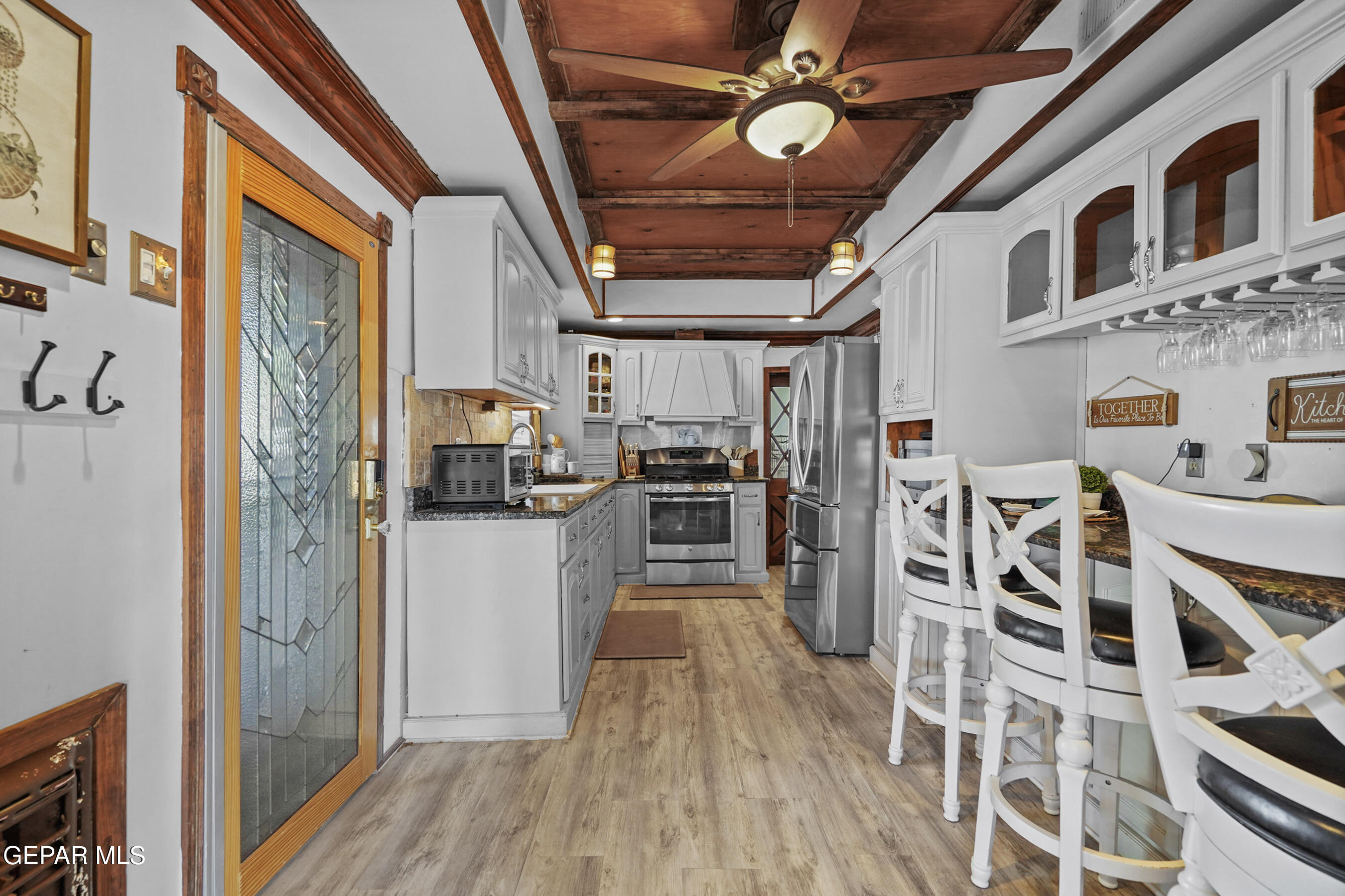 146 Croom Road El Paso, TX 79915 - Photo 4 of 54 a kitchen with stainless steel appliances granite countertop a refrigerator and a stove top oven