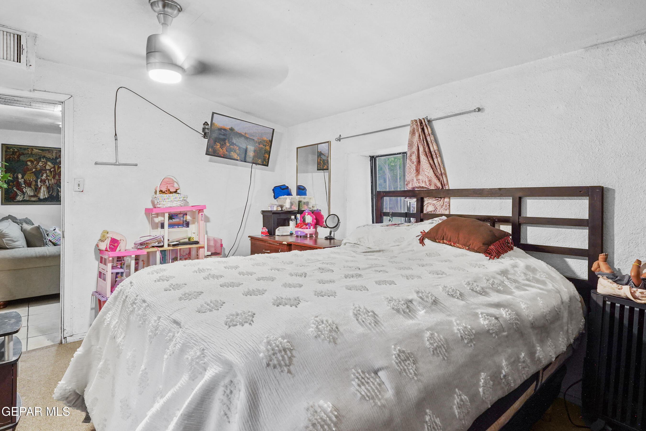 146 Croom Road El Paso, TX 79915 - Photo 42 of 54 a bedroom with a bed and a chandelier