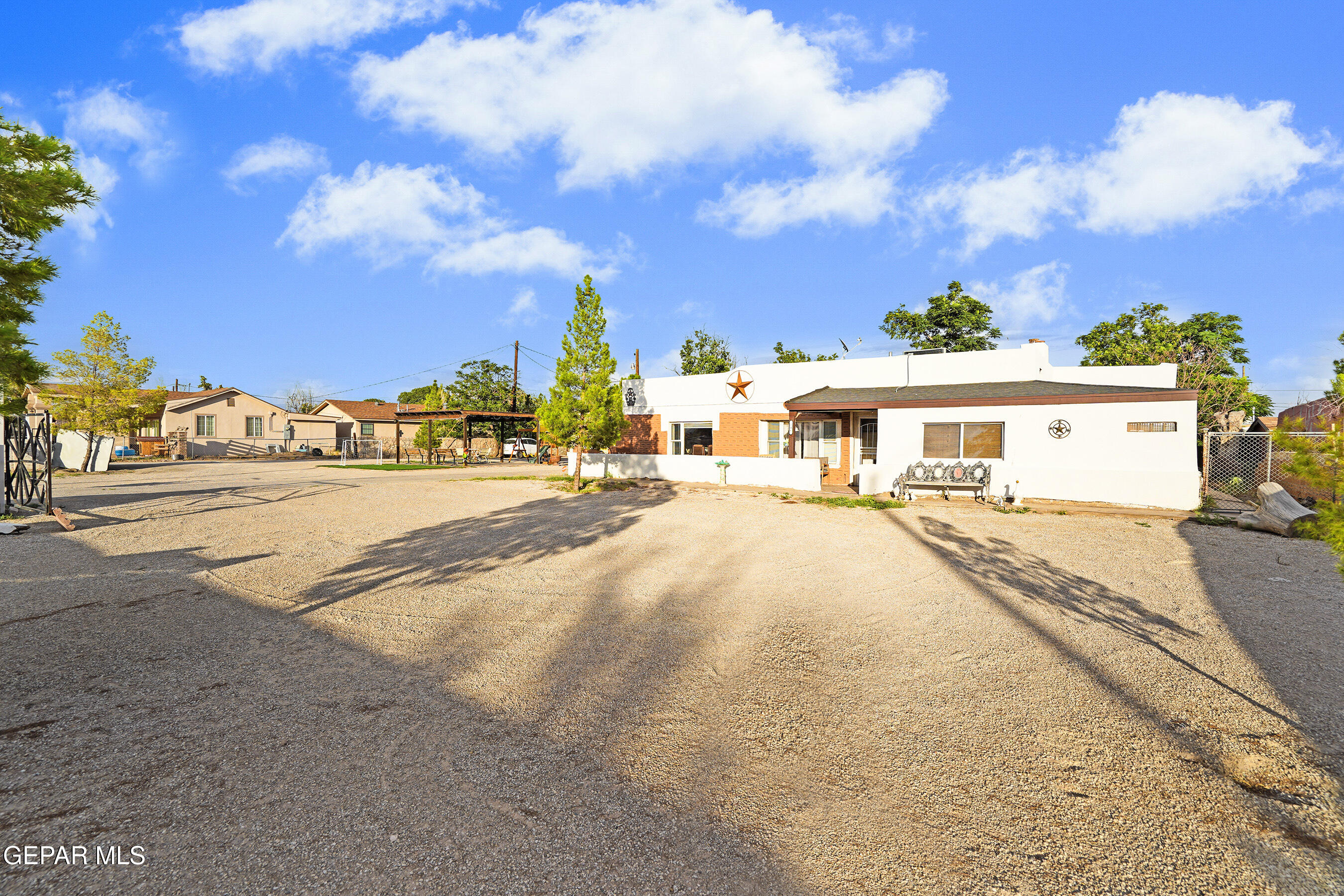 146 Croom Road El Paso, TX 79915 - Photo 49 of 54 a front view of a house with a garden and balcony