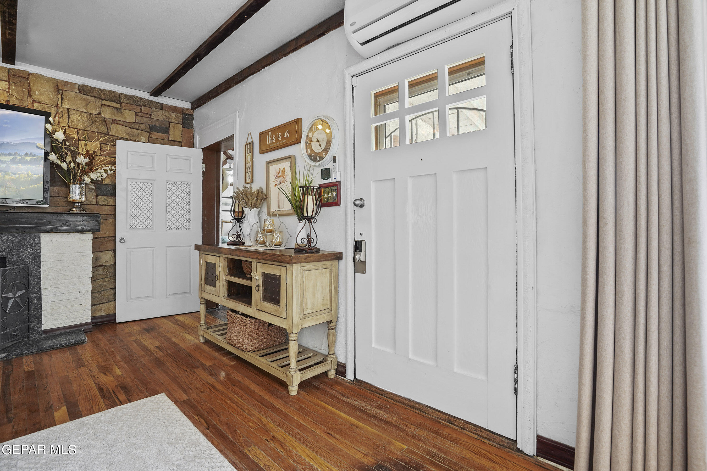 146 Croom Road El Paso, TX 79915 - Photo 6 of 54 a view of an entryway with wooden floor and door