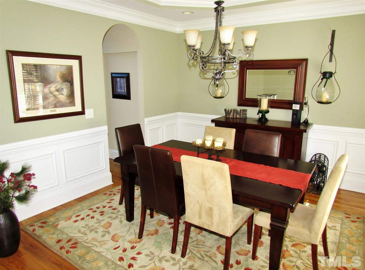 3810 Congeniality Way Raleigh, NC 27613 - Photo 3 of 25 Spacious dining room features a trey ceiling and heavy trim. Dining Room