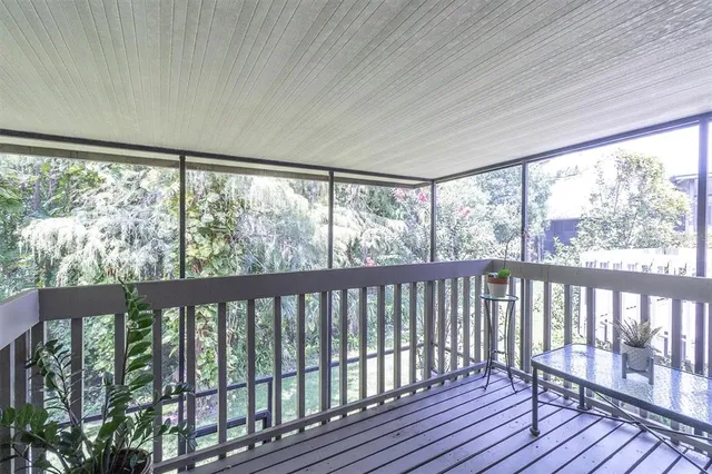 a view of a large window with wooden floor