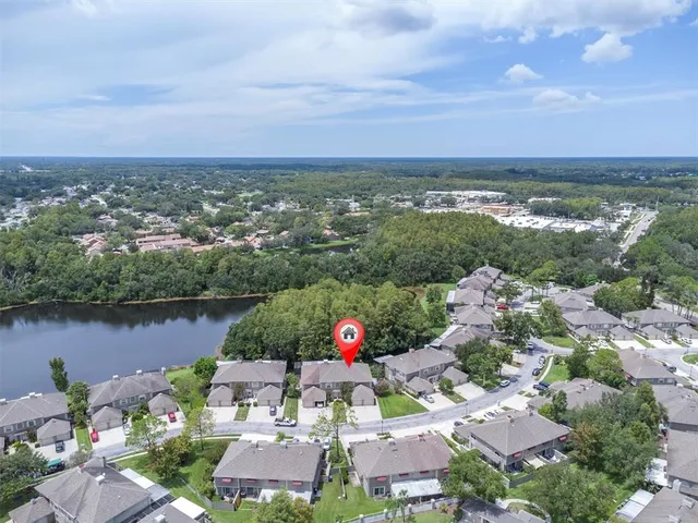 an aerial view of a houses with city view and lake view