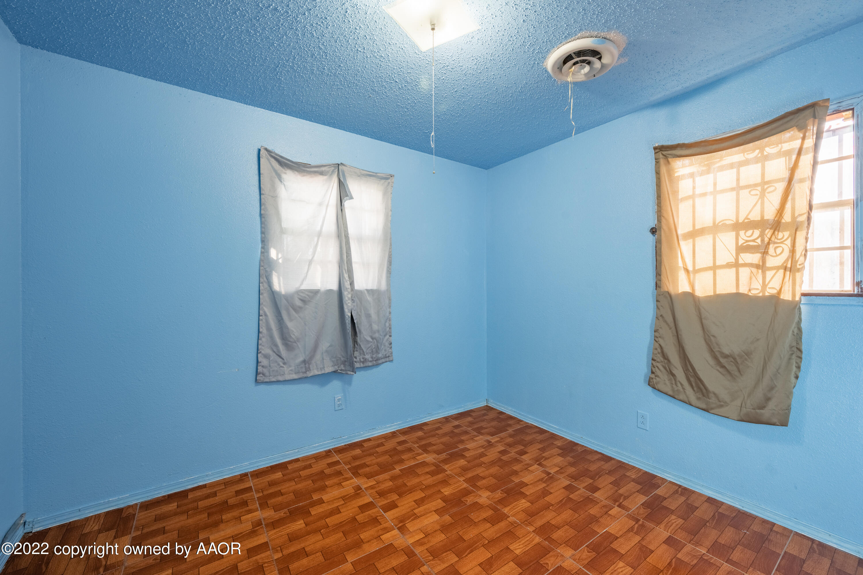 920 Heather Street Amarillo, TX 79107 - Photo 14 of 23 a view of a room with window and wooden floor