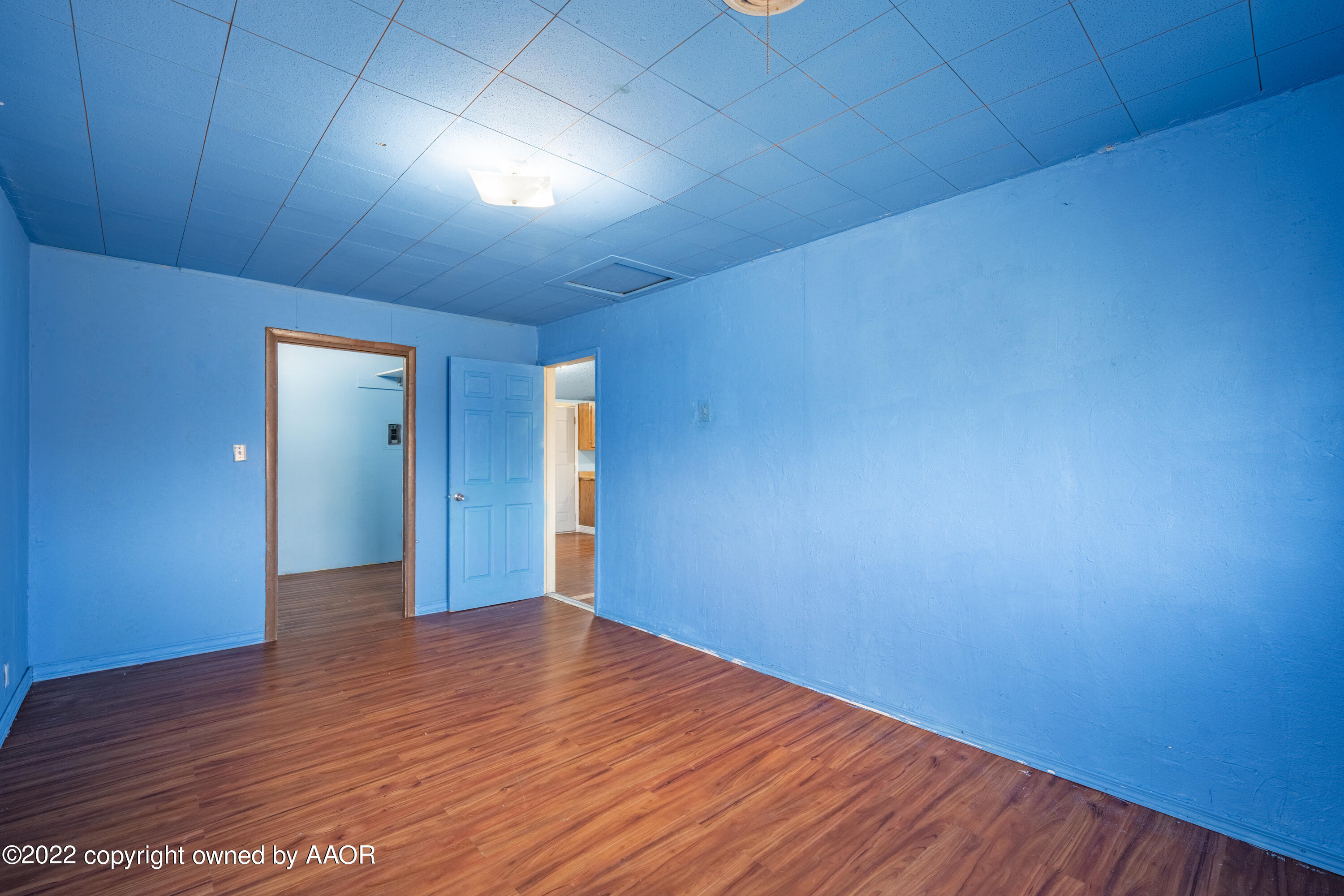 920 Heather Street Amarillo, TX 79107 - Photo 19 of 23 a view of empty room with wooden floor