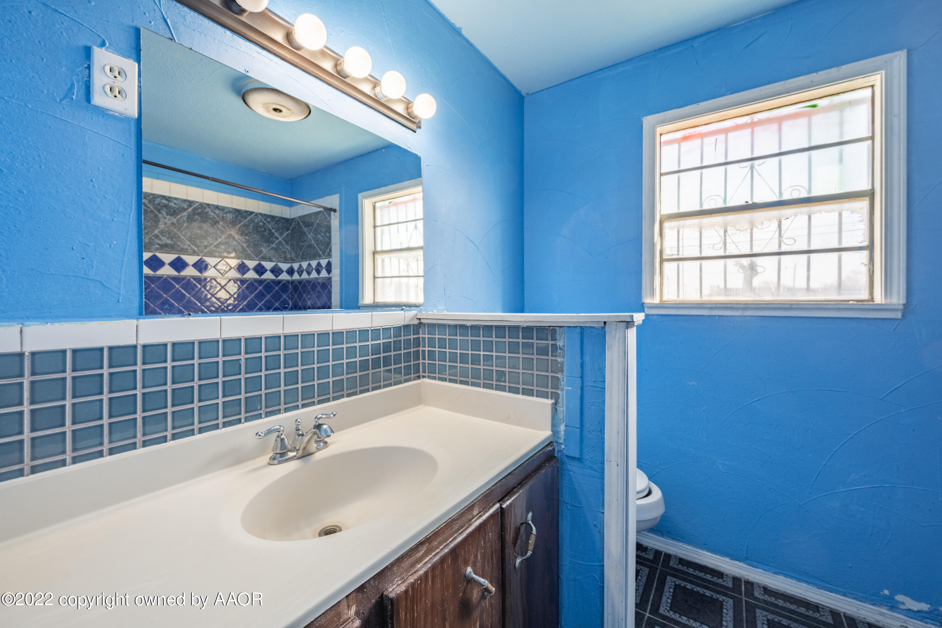 920 Heather Street Amarillo, TX 79107 - Photo 10 of 23 a bathroom with a sink and a vanity