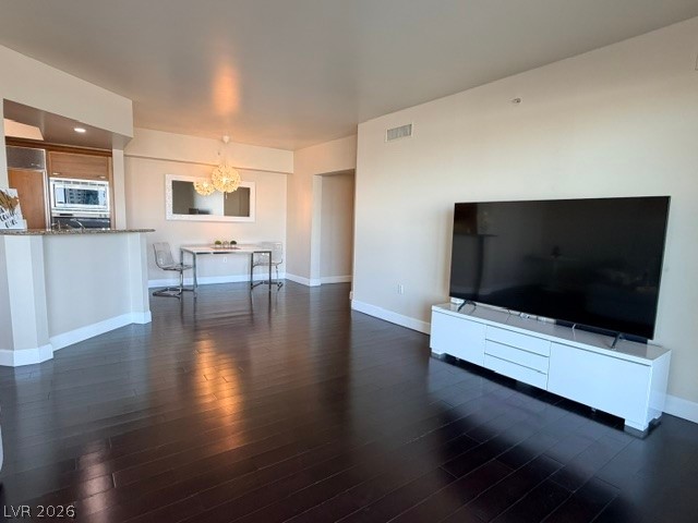 2777 Paradise Road, Unit 807 Las Vegas, NV 89109 - Photo 46 of 61 Refined wood floors extend through this open-concept kitchen and living area, ideal for relaxed entertaining.