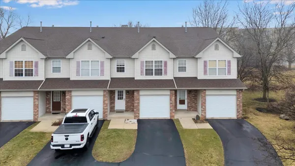 a front view of a house with parking space