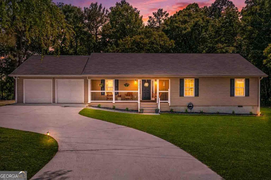 1596 Stark Road Jackson, GA 30233 - Photo 1 of 1 a front view of a house with a garden