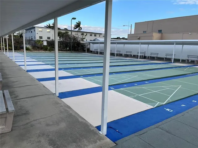 a view of a balcony with chairs and floor