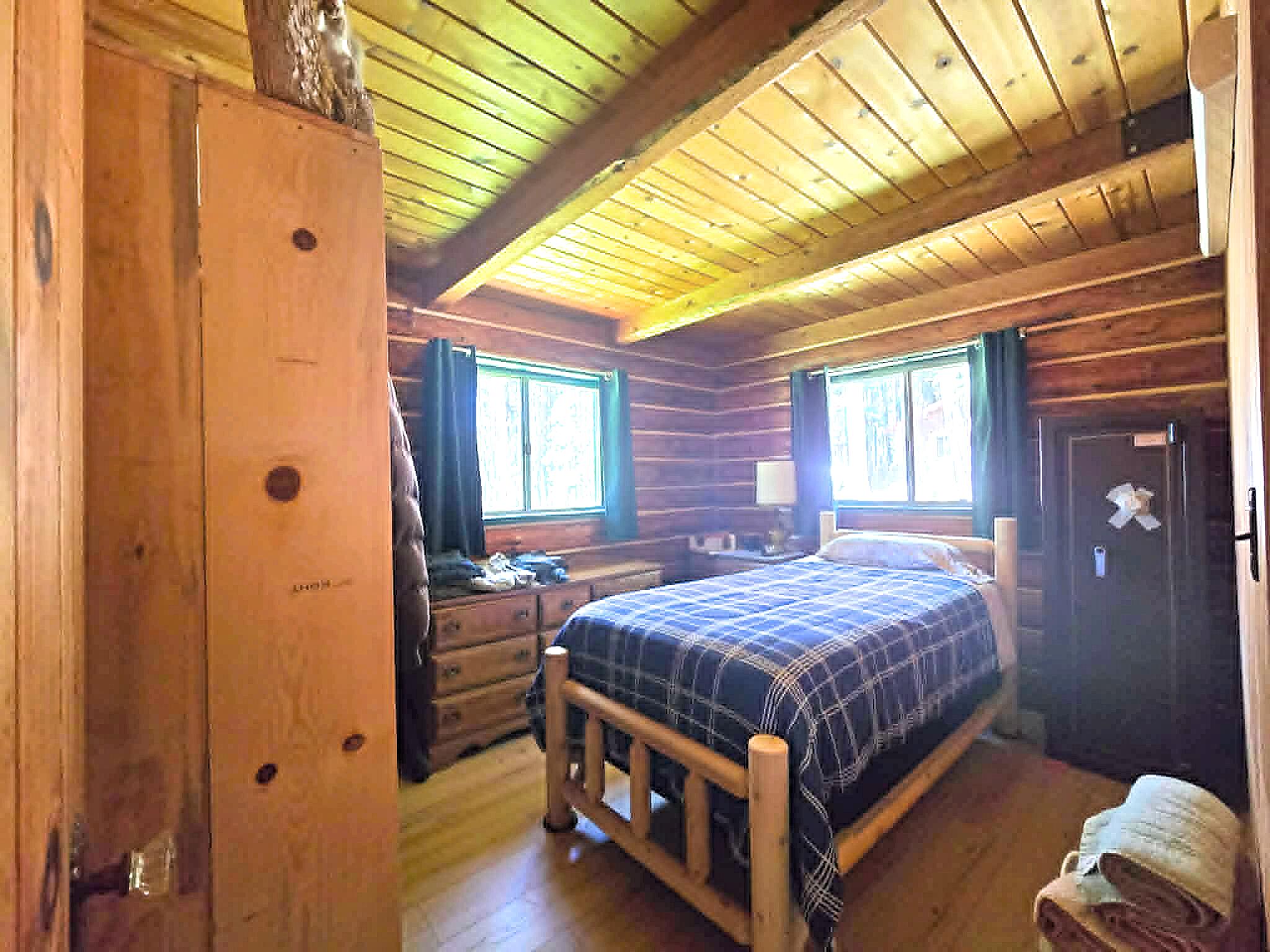 836 Ulrich Road Prospect, OR 97536 - Photo 17 of 47 a bedroom with a bed and a window