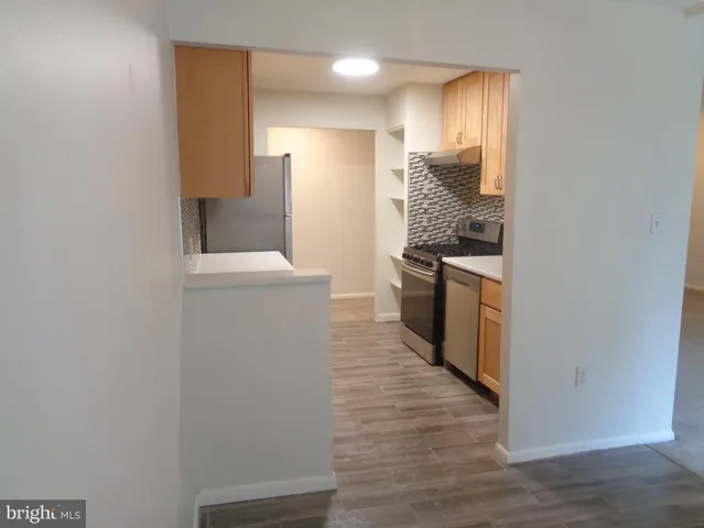 a view of a kitchen from the hallway