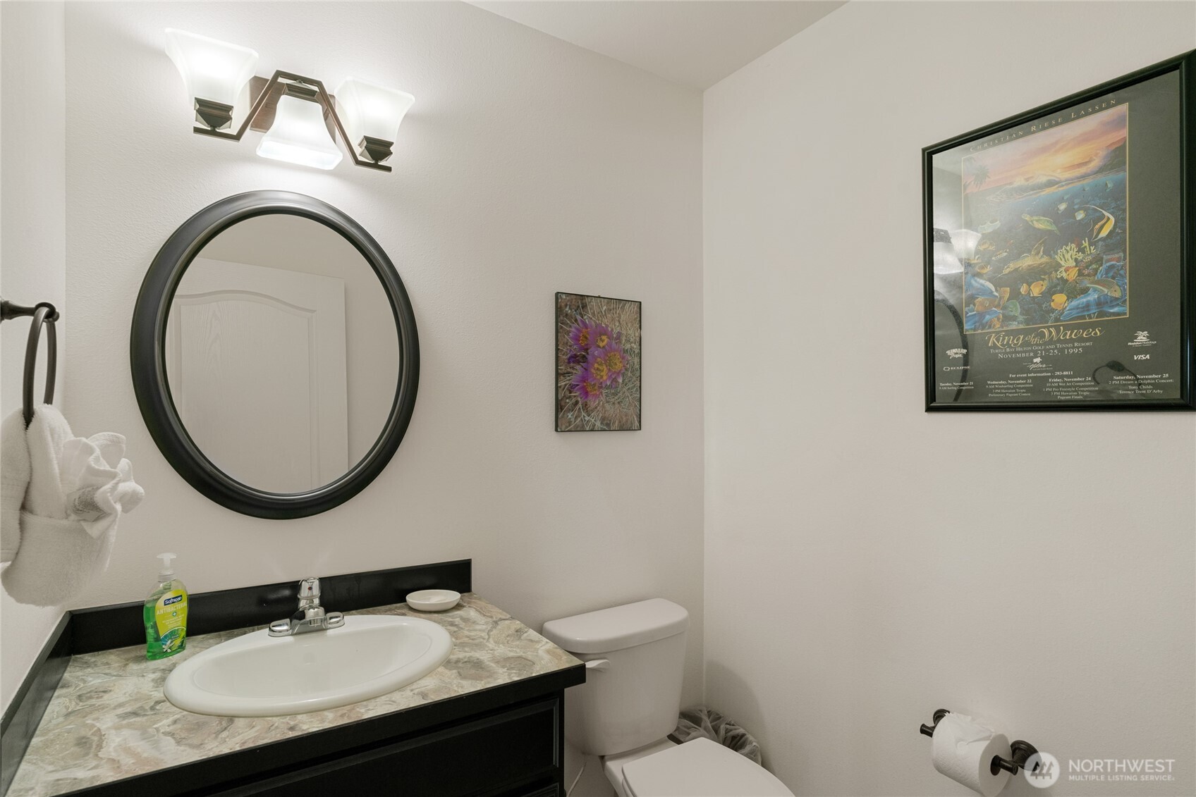 165 Granite Falls Road Chelan, WA 98816 - Photo 22 of 27 a bathroom with a granite countertop toilet sink and mirror