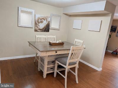 21 Ojibway Road Randallstown, MD 21133 - Photo 4 of 6 a view of a dining room with furniture and wooden floor