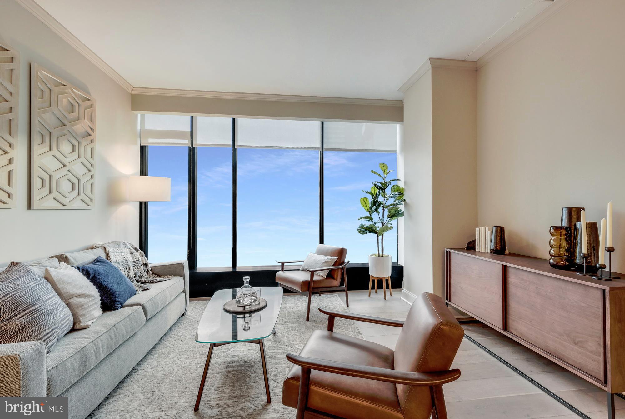 30 North 23rd Street, Unit 2207 Philadelphia, PA 19103 - Photo 7 of 42 a living room with furniture and a potted plant