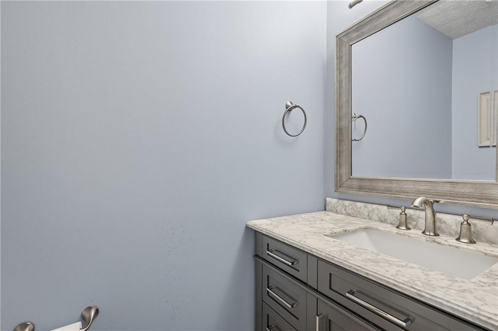 122 Rippling Brook Drive Sewickley, PA 15143 - Photo 14 of 31 a bathroom with a granite countertop sink and vanity