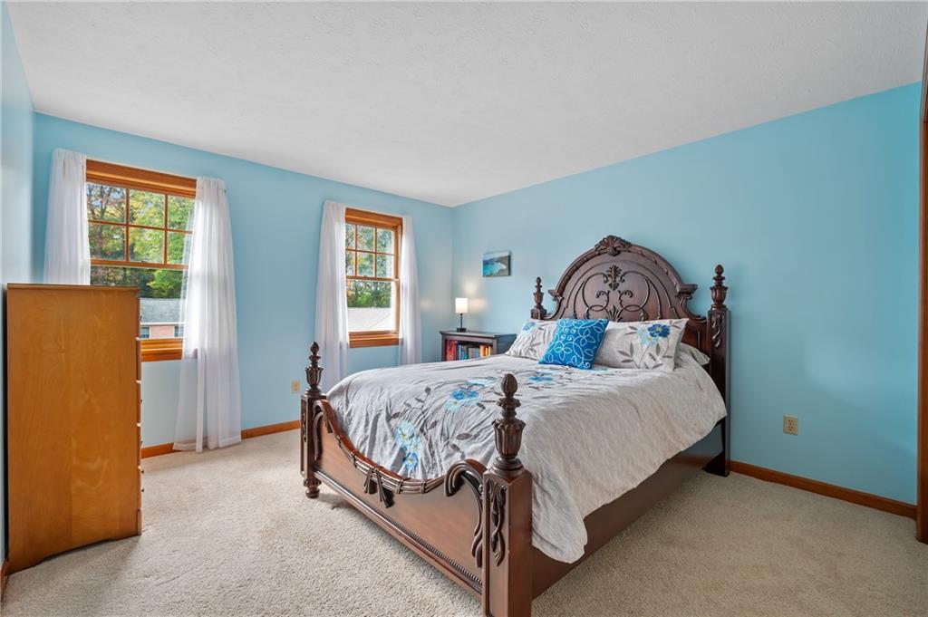 122 Rippling Brook Drive Sewickley, PA 15143 - Photo 19 of 31 a bedroom with a bed and window