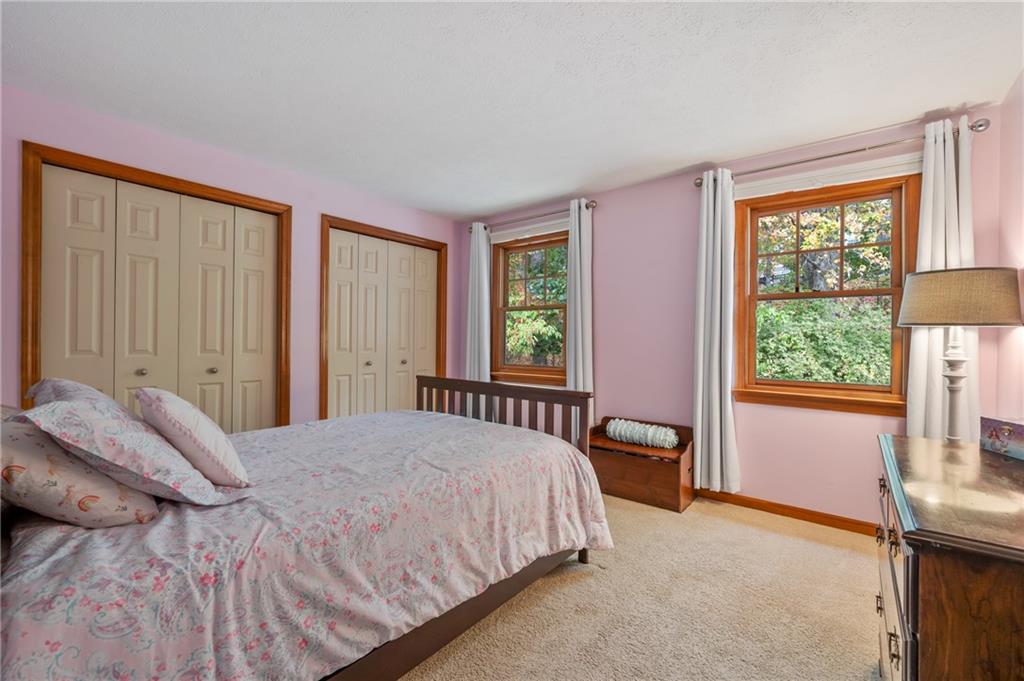122 Rippling Brook Drive Sewickley, PA 15143 - Photo 20 of 31 a bedroom with a bed and a window